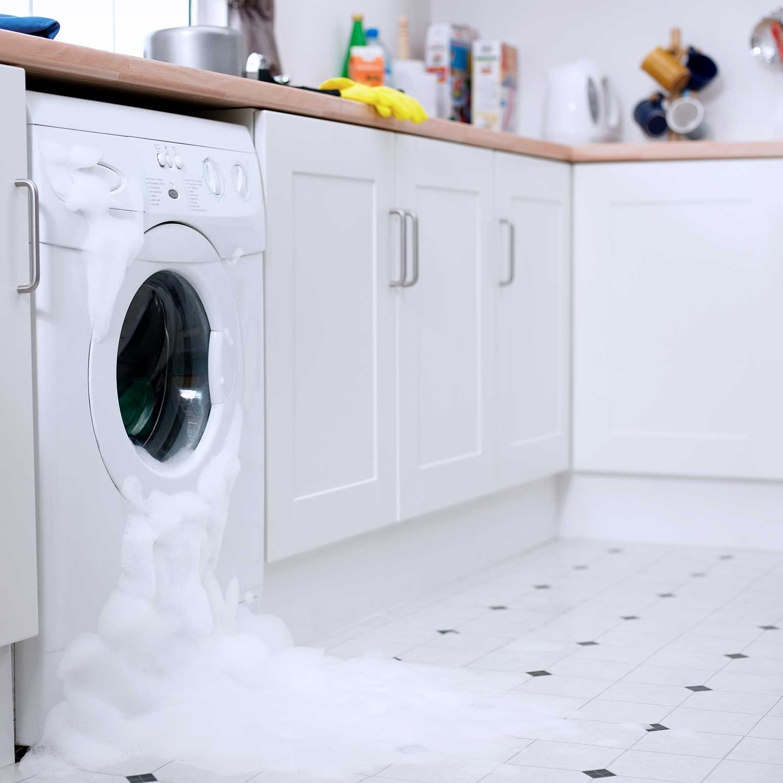 Washing machine overflowing in kitchen
